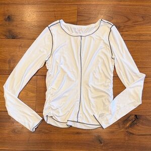 FP Movement Right On Run layer. Side ruching, moisture wicking. White large